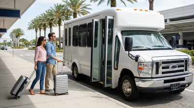 An off-airport car rental shuttle bus picking up passengers and luggage at the Orlando airport terminal