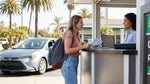 Young driver in a convertible enjoying a scenic California coastal drive with their car hire