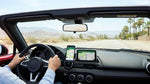 Smartphone showing a map route mounted on the dashboard of a car rental in Las Vegas