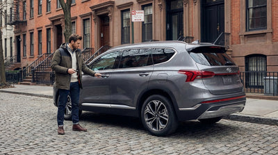 A modern keyless car hire vehicle parked on a bustling street in New York City