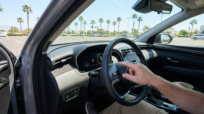 A car rental dashboard in California with the maintenance required warning light illuminated next to the steering wheel
