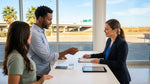 Customer handing a driver's licence to an agent at a car rental desk in Texas