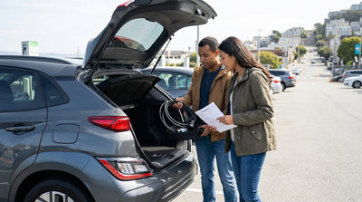 A modern electric car rental parked with a view of the Golden Gate Bridge in San Francisco