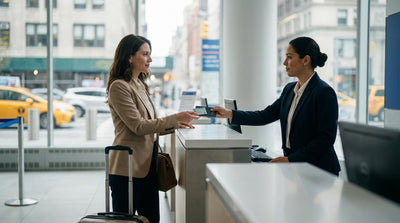 A driver's view from a car hire on a bridge driving towards the iconic New York City skyline on a sunny day
