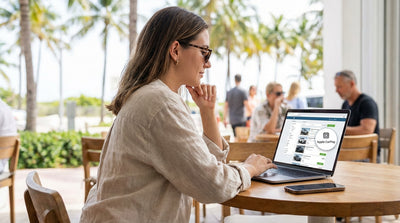 A driver's view of a car rental dashboard with Apple CarPlay navigating a sunny street in Miami
