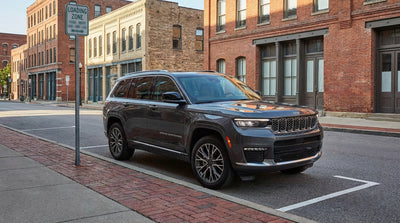 A car hire stopped near a Loading Zone sign on a city street in Philadelphia, Pennsylvania