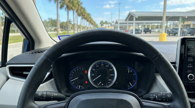 Dashboard of a car rental in Florida with the red airbag SRS warning light illuminated