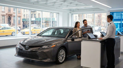 A person unlocking their car rental on a busy street in New York, with yellow cabs and skyscrapers in the background