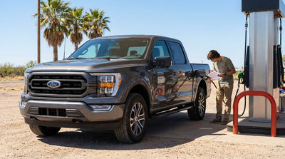 A person at a Texas gas station checks the fuel type on their recent car hire before filling up