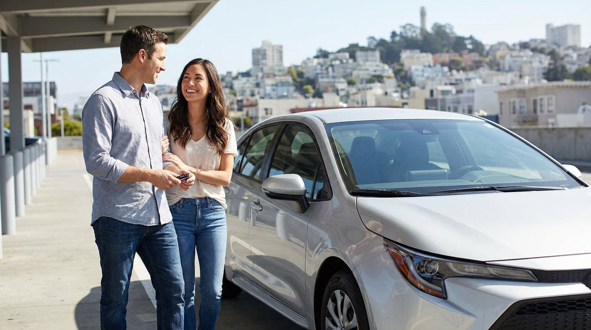 A red convertible car rental driving across the Golden Gate Bridge in San Francisco on a sunny day