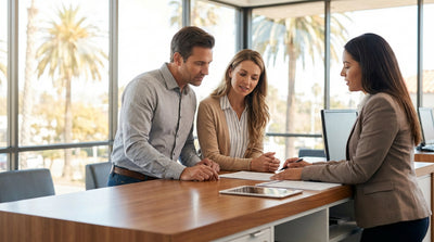 A modern car rental driving on a scenic coastal highway in California with ocean views