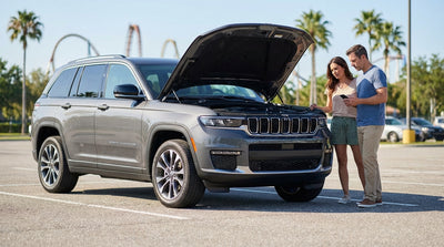 A person looks under the open hood of a car hire in a sunny Florida theme park parking lot