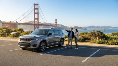 A car hire parked at a scenic viewpoint overlooking the iconic Golden Gate Bridge in San Francisco