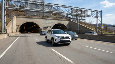 Driving a car rental from the Fort Pitt Tunnel toward the Pittsburgh, Pennsylvania skyline and bridges