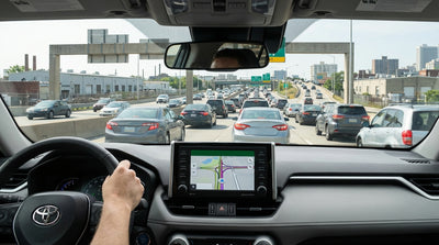 A car hire drives in traffic on the I-76 Schuylkill Expressway with the Philadelphia skyline visible