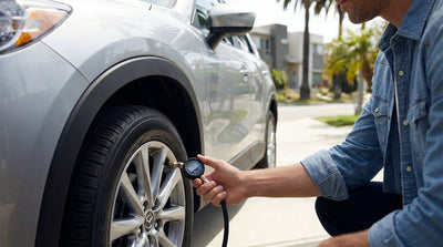 The dashboard of a car hire in Los Angeles showing tire pressure readings in kPa on a digital screen
