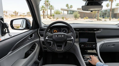 A car hire driving down the famous Las Vegas Strip at night, surrounded by glowing neon casino signs