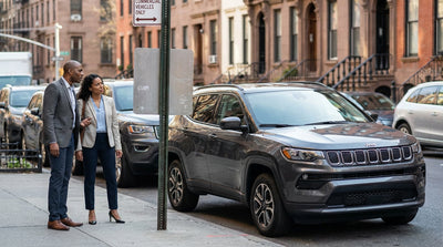 A car hire vehicle parked on a New York street beside a 'Commercial Vehicles Only' parking sign