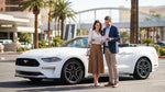 Agent handing keys to a customer at a car rental counter in Las Vegas