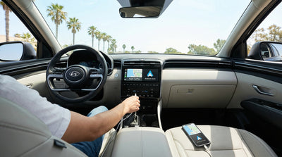 A driver plugs a smartphone into the dashboard of a car rental to use a map app in Orlando