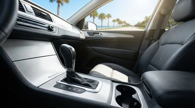 A convertible car hire driving on a sunny coastal highway lined with palm trees in Florida