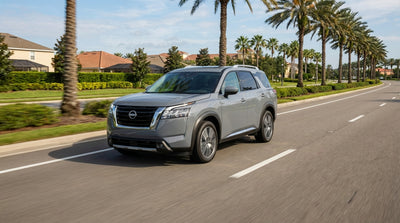 View from a car hire of a traffic jam with a yellow school bus on a sunny street in Orlando