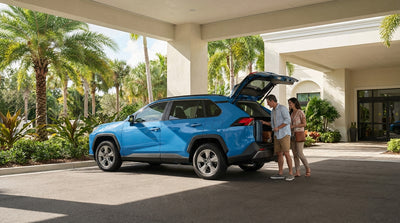 A convertible car hire on a sunny day driving down Miami's palm tree-lined Ocean Drive