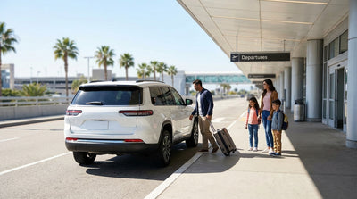A family drops off luggage from their car hire at the MCO departures curb in Orlando