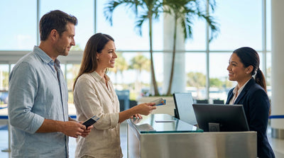 A red convertible car hire on a sunny coastal road with palm trees in Florida