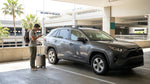 A driver's view of confusing car hire return signs on a sunny day at the Los Angeles LAX airport