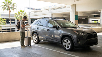 A driver's view of confusing car hire return signs on a sunny day at the Los Angeles LAX airport