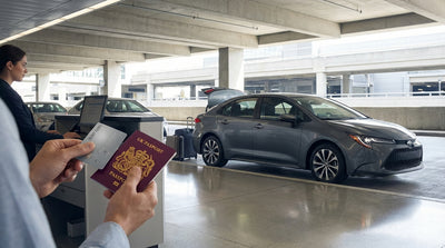 A car rental parked on a hill with a clear view of the Golden Gate Bridge in San Francisco