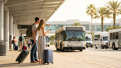 Travelers waiting for an off-airport car hire shuttle bus outside the Orlando airport arrivals terminal