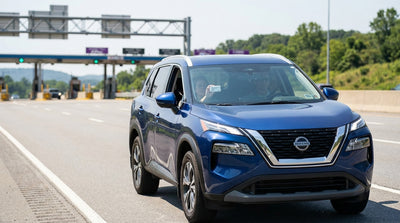 A modern car hire driving on a highway through the scenic green hills of Pennsylvania