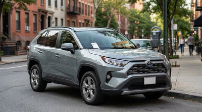 A yellow parking ticket on the windscreen of a car hire vehicle on a street in New York