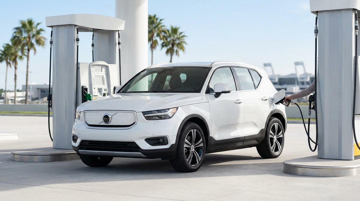 A driver refueling a white car rental at a gas station on a sunny day in Orlando