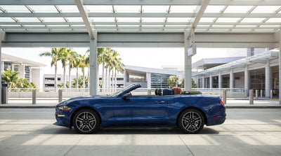 Travelers queuing at the busy car rental center inside the Miami International Airport