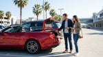 A row of vehicles waits at a car hire pickup area at LAX airport in Los Angeles