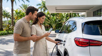A modern electric car plugged into a charging station on a sunny street in Miami for a car hire trip