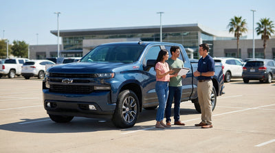 A convertible car hire driving on a highway through the scenic Texas landscape at sunset
