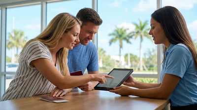 A convertible car rental driving on a sunny, palm-lined coastal highway in Florida