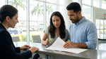 A customer carefully reads a car hire agreement at an airport rental counter in Orlando