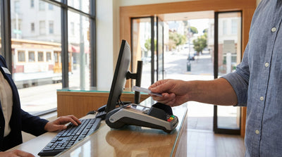 A red convertible car hire driving across the Golden Gate Bridge in San Francisco on a sunny day