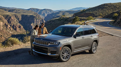 A car hire driving the scenic, winding road of Angeles Crest Highway with mountain views near Los Angeles