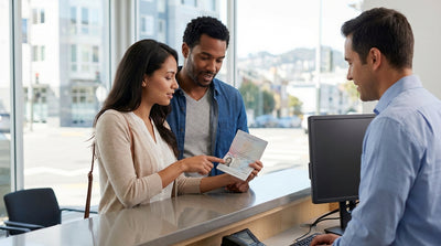 A red convertible car hire driving over the Golden Gate Bridge in San Francisco on a sunny day