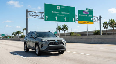 View from a car rental on a sunny Texas highway approaching a confusing array of overhead toll signs