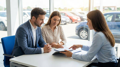 A car hire driving on a sunny, open highway road trip through the mountains of the United States