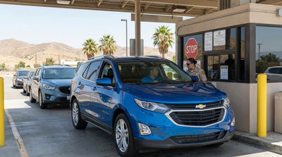 A car rental driving up to the California agricultural inspection station checkpoint on the freeway