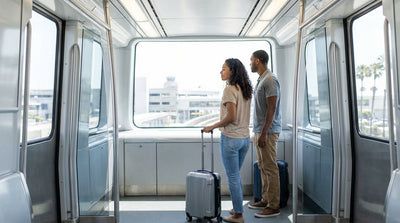 The MIA Mover train arriving at the Miami International Airport car rental center under a clear blue sky