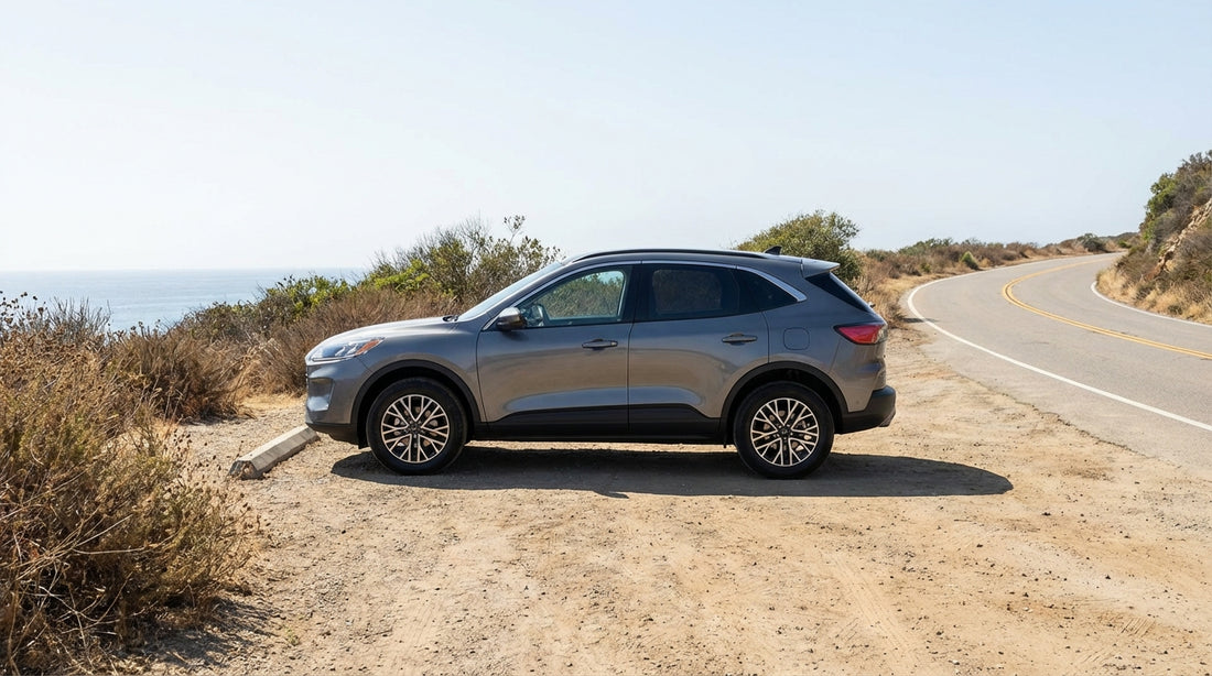 A car hire parked on the Pacific Coast Highway in Los Angeles with Malibu's coastline in the background